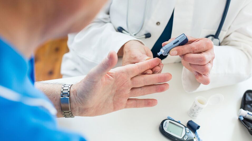 a doctor takes blood sugar for diabetes